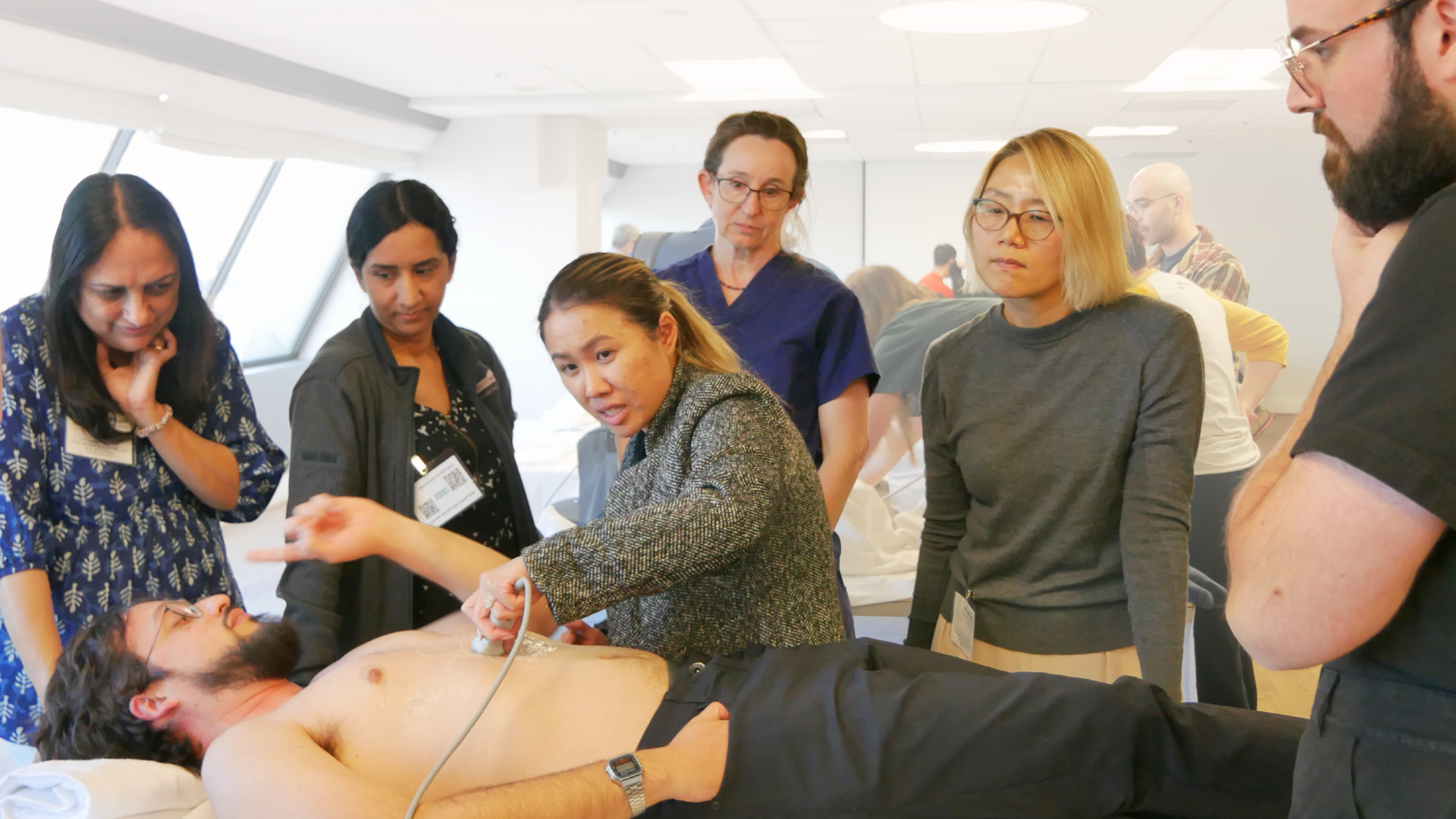 Primary care clinicians performing scans during an OSCE-style assessment at GUSI’s POCUS training course in San Francisco.